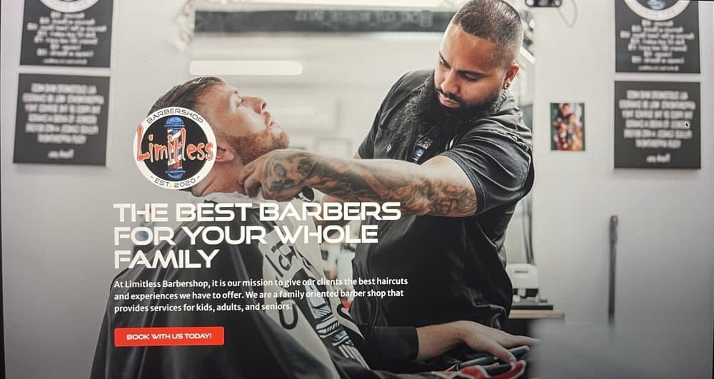 Limitless Barbershop homepage hero: portrait of a barber at work with the line The best barbers for your whole family