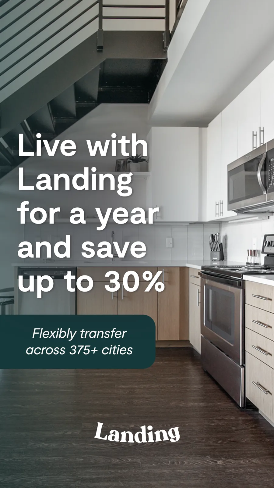 A tall ad over a modern kitchen under a stair: a large headline about living with the brand for a year and saving up to 30 percent, the logo below.