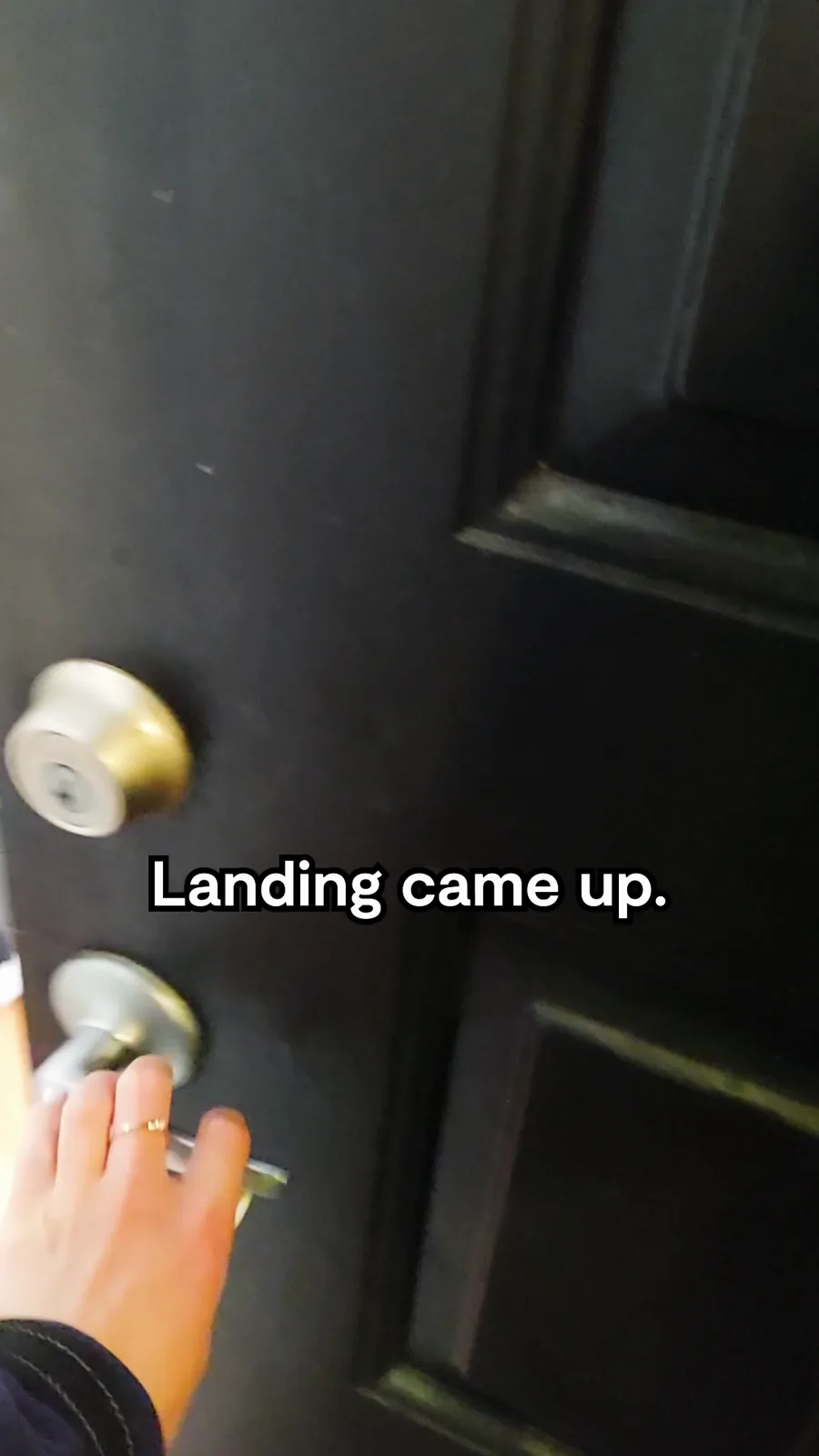 A tall video still: a hand opens a dark apartment door, a caption saying the brand came up.