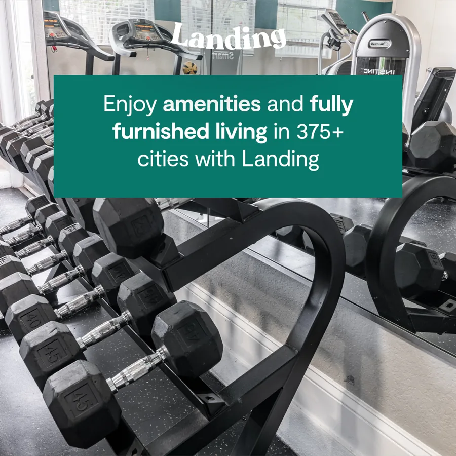 A square ad over a gym rack of dumbbells: the logo and a green box about amenities and furnished living in hundreds of cities.