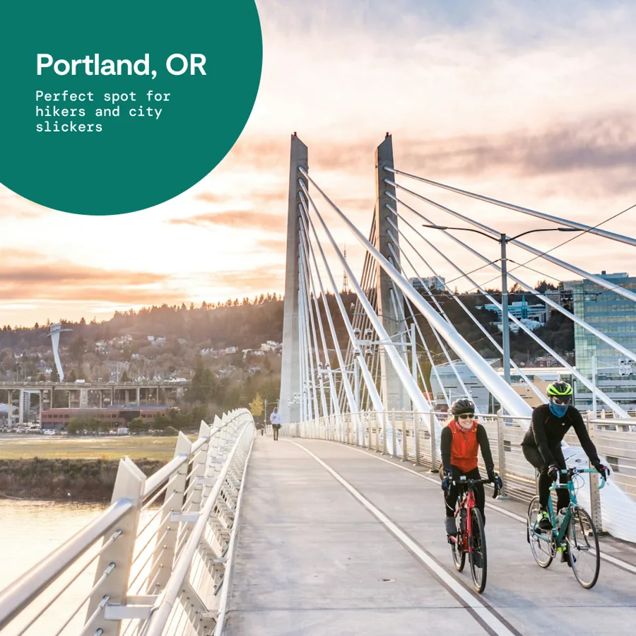 A square ad: two cyclists cross a white cable bridge at sunset, a green circle naming the city and the line "Perfect spot for hikers and city slickers".