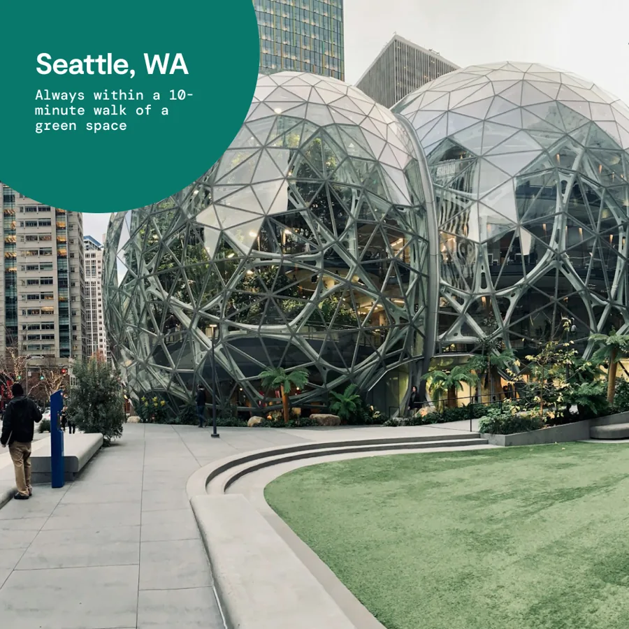 A square ad: giant glass domes beside a lawn and plaza, a green circle naming the city and a line about always being near a green space.