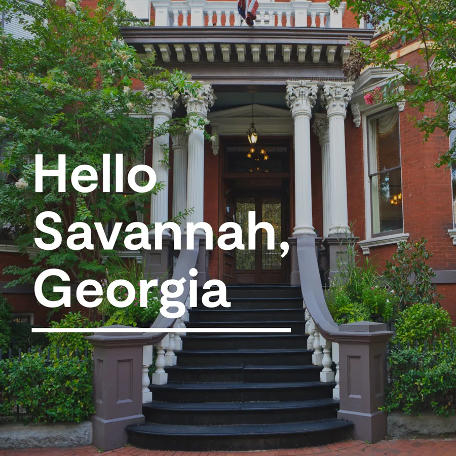 A square ad: a grand brick house with white columns and curved stone stairs, a large white greeting to the city set over it.